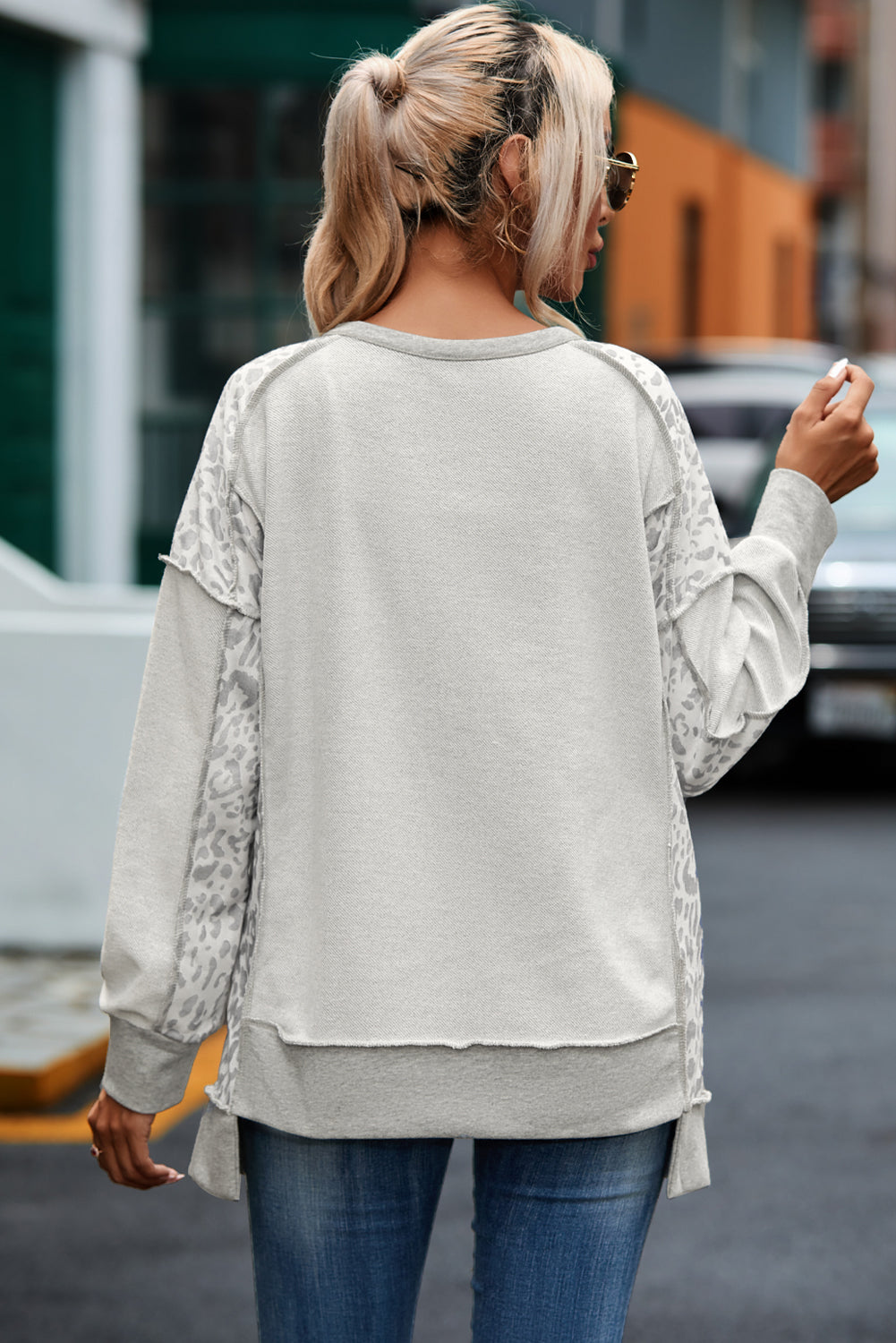 Gray Sweatshirt with buttoned collar and exposed seams in leopard patchwork