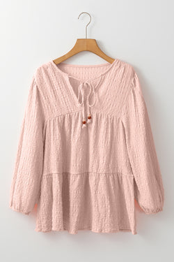 Light pink textured fluid blouse on several levels