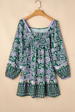 Green dress with floral print and border *