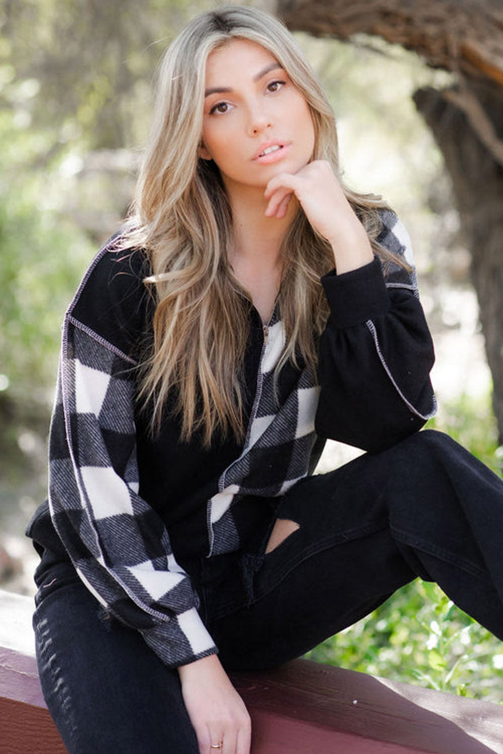 Black checkerboard patchwork collared top with exposed seams