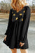 Black babydoll dress with ruffles and glitter stars with fluffy sleeves