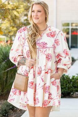 Mini dress with floral print with lace -ups and V -neck with large white balloon sleeves