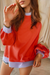 Orange raglan sleeve loose top with side slits and color blocking