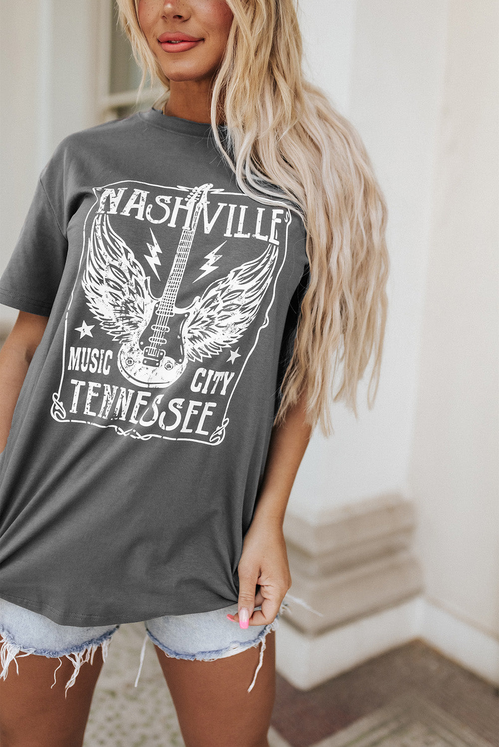 Camiseta gris de gran tamaño con estampado gráfico y letra con eslogan de guitarra