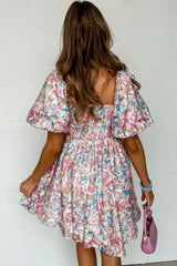 Pink smocked dress with ruffles and floral puff sleeves, square neck