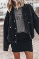 Black denim jacket with flap pockets and dropped shoulders with metal buttons