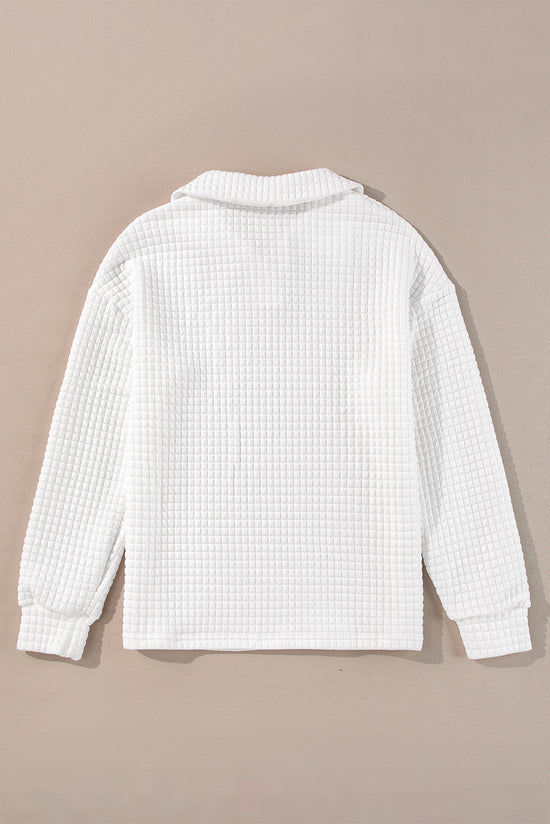 White long sleeve top with sporty collar and quilted texture