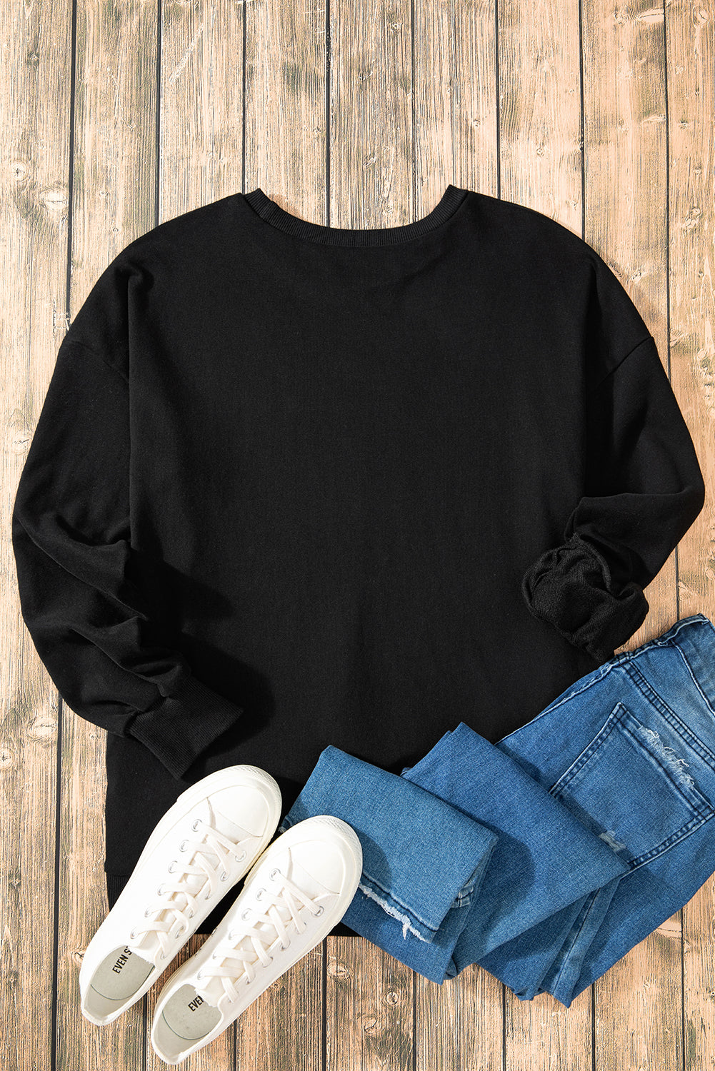 Sweat-shirt noir uni à col rond et ourlet haut et bas