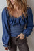 Smocked dark blue jeans blouse with ruffles and puffy sleeves in V -neck